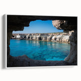 Framed canvas wall art showcasing a serene landscape with caves, displayed from a side view against a white backdrop, perfect for modern home decor.