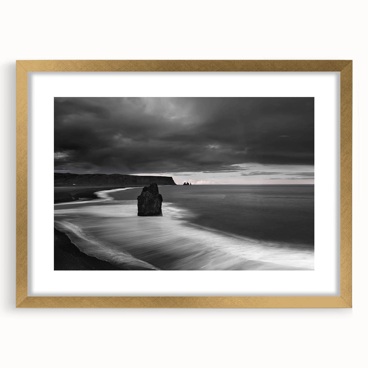 Framed wall art showcasing a breathtaking landscape of rugged cliffs with vibrant colors, accented by a gold mat, perfect for enhancing home decor aesthetics.