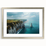 Framed wall art featuring a stunning landscape of cliffs, showcasing vibrant colors and intricate details, elegantly presented with a silver mat for a modern touch.