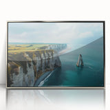 Framed wall art featuring a stunning landscape of cliffs, designed with vibrant colors and intricate details, showcased in a sleek silver frame, ideal for home decor.