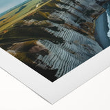 Vibrant rolled canvas wall art showcasing a stunning landscape with dramatic cliffs and rich colors, ideal for enhancing home decor and interior design aesthetics.