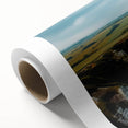Vibrant rolled canvas artwork showcasing a stunning landscape of cliffs and mountains, perfect for home decor, presented in a protective cardboard tube.