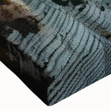 Close-up of a stretched canvas wall art featuring a vibrant landscape design with cliffs, showcasing rich colors and intricate details, perfect for home decor.