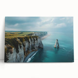 Stretched canvas wall art showcasing a stunning landscape of cliffs with vibrant colors, leaning against a wall, perfect for home decor and nature lovers.
