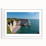 Wall art featuring a stunning mountain landscape with cliffs and vibrant colors, framed with a white mat for elegant display, perfect for home decor enhancement.