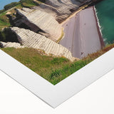 Stunning rolled canvas wall art showcasing a vibrant landscape of cliffs at sunset, featuring rich colors of orange, purple, and blue, perfect for home decor.