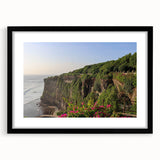 Framed black wall art featuring a serene landscape of cliffs and mountains, showcasing vibrant colors and intricate details, perfect for home decor enhancement.