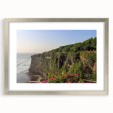 Framed wall art featuring a scenic landscape of dramatic cliffs, elegantly designed with a silver mat, perfect for home decor and interior aesthetics. The artwork showcases natural beauty and adds a sophisticated touch to any living space.
