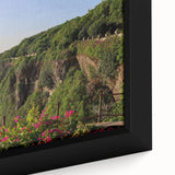 Close-up of a framed canvas artwork showcasing stunning cliffs and landscapes in vibrant colors, ideal for enhancing modern home decor with a nature-inspired theme.