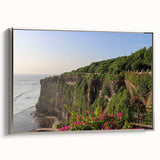 Framed canvas wall art showcasing a serene landscape of cliffs under a vibrant blue sky, featuring silver accents on the frame, ideal for modern home decor.