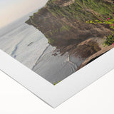 Vibrant rolled canvas depicting a serene landscape of rugged cliffs and lush greenery, showcasing intricate details and rich colors, perfect for home decor.