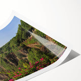 Vibrant rolled print of a dramatic cliff landscape, showcasing rich colors and textures, perfect for enhancing home decor with a natural touch.