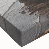 Close-up of a vibrant stretched canvas wall art piece showcasing a dramatic cliff landscape with rich textures and bold colors, ideal for modern home decor.