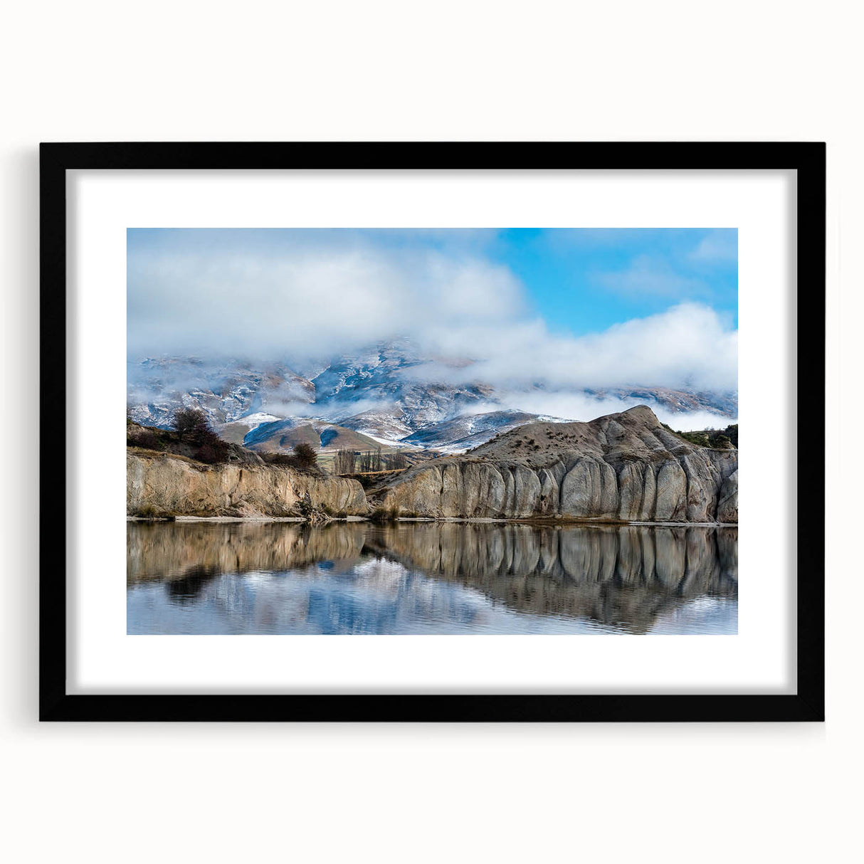 Black-framed wall art showcasing a stunning cliff landscape design, featuring vibrant colors and intricate details, perfect for enhancing modern home decor.