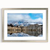 Framed wall art featuring a scenic landscape of cliffs, designed with a silver mat and frame, showcasing serene natural beauty ideal for home decor.