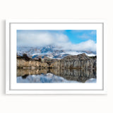 Framed wall art featuring a stunning landscape of cliffs, set in a white mat, showcasing vibrant colors and intricate details, perfect for home decor.