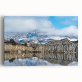 Vibrant stretched canvas artwork showcasing a breathtaking landscape of cliffs against a blue sky, perfect for enhancing home decor with natural beauty and serenity.