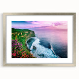Framed wall art featuring a stunning landscape of cliffs in vibrant colors, elegantly displayed with a silver mat, perfect for home decor enhancement.