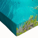 Close-up of a vibrant stretched canvas wall art piece depicting dramatic cliffs and landscapes, showcasing rich colors and detailed textures, perfect for modern decor.