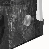 Close-up view of an acrylic glass wall art piece showcasing a vibrant landscape of cliffs, featuring rich colors and intricate details, ideal for home decor.