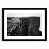 Framed wall art featuring a scenic landscape of cliffs, presented in a sleek black frame, perfect for enhancing modern home decor with natural beauty.