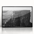 Framed acrylic wall art featuring a stunning landscape of rugged cliffs, designed in a modern style with a sleek black frame, perfect for enhancing home decor.