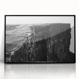 Framed acrylic wall art featuring a stunning landscape of rugged cliffs, designed in a modern style with a sleek black frame, perfect for enhancing home decor.