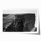 Vibrant rolled print showcasing a stunning landscape of cliffs and ocean waves, perfect for home decor, emphasizing natural beauty and tranquility.