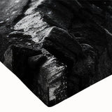 Close-up of a stretched canvas wall art piece showcasing a vibrant landscape design with cliffs and vivid colors, ideal for home decor and modern interiors.