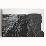 Colorful stretched canvas wall art featuring a dramatic landscape of cliffs against a vibrant sunset, ideal for home décor. Perfect for adding a touch of nature-inspired beauty to any room.