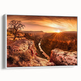 Framed canvas wall art depicting a serene landscape with dramatic cliffs, featuring earthy tones and a white frame, perfect for enhancing modern decor aesthetics.