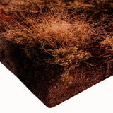 Close-up of a stretched canvas wall art piece showcasing a stunning landscape of cliffs, featuring vibrant colors and intricate details, ideal for home decor.