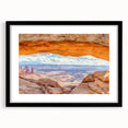 Framed wall art featuring a stunning landscape of cliffs, presented in a sleek black frame with a mat, ideal for enhancing home decor and showcasing natural beauty.