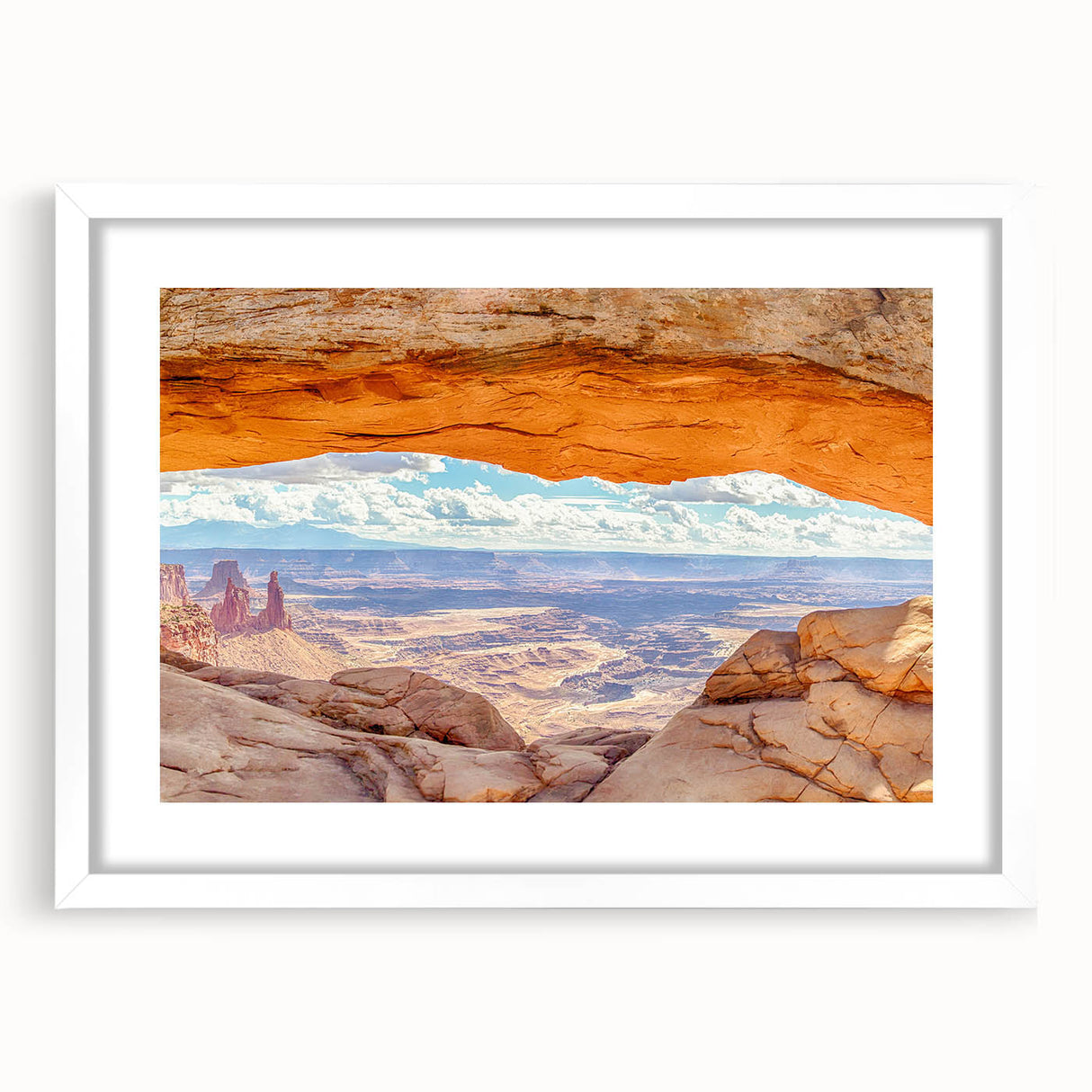 Framed wall art featuring a serene landscape of cliffs and greenery, presented in a white mat, perfect for enhancing modern home decor. Ideal for nature lovers and interior design enthusiasts.