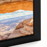 Close-up of a framed canvas wall art piece showcasing a vibrant landscape of cliffs, featuring rich colors and intricate details, perfect for home decoration.