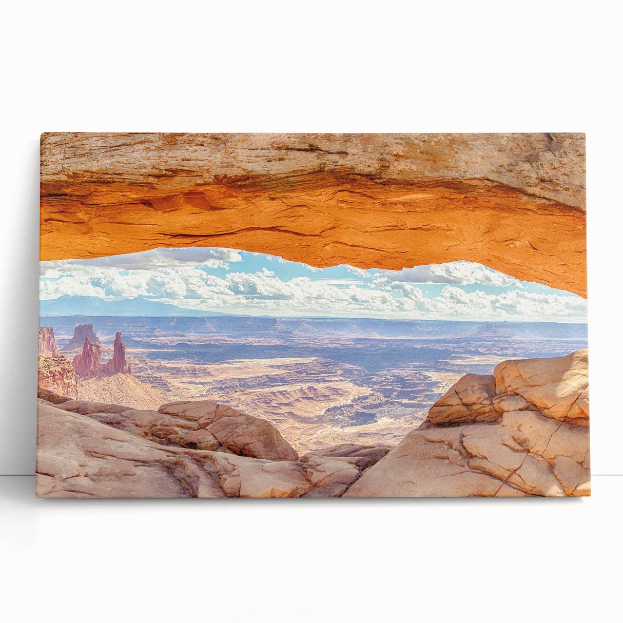 Stretched canvas wall art showcasing a breathtaking landscape of cliffs at sunset, featuring vibrant oranges and deep blues, perfect for modern home decor.