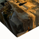 Close-up of a stretched canvas wall art piece showcasing vibrant landscapes and cliffs, featuring rich colors and intricate details, perfect for home decor.