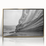 Framed wall art featuring a stunning landscape of cliffs, accented with golden hues and a sleek acrylic front, perfect for enhancing modern decor.