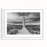 Framed wall art showcasing a serene landscape of cliffs and ocean waves, featuring a white mat and elegant design, perfect for home or office decor.