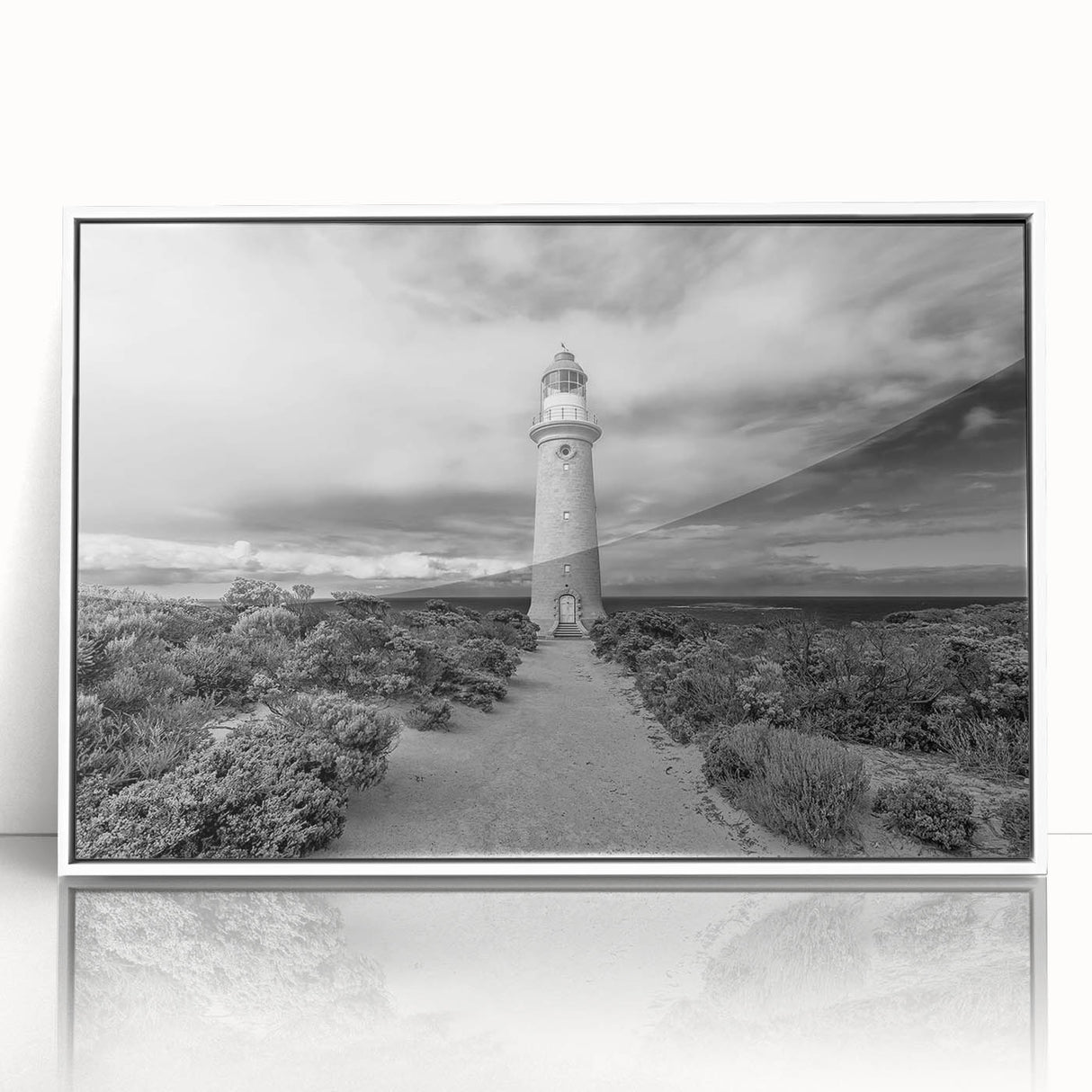 Framed acrylic wall art featuring a stunning landscape of cliffs, displayed in white, perfect for modern home decor. Adds a serene touch to any living space.