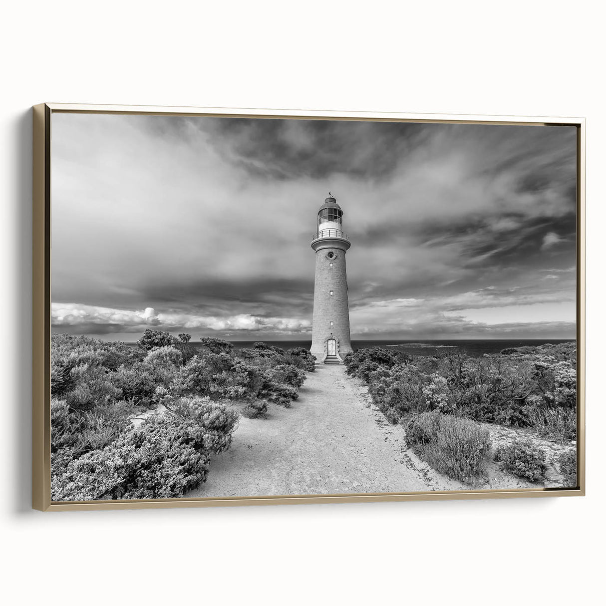 Framed canvas wall art featuring a stunning landscape of cliffs at sunset, highlighting vibrant gold accents and soft hues. Ideal for modern home decor.