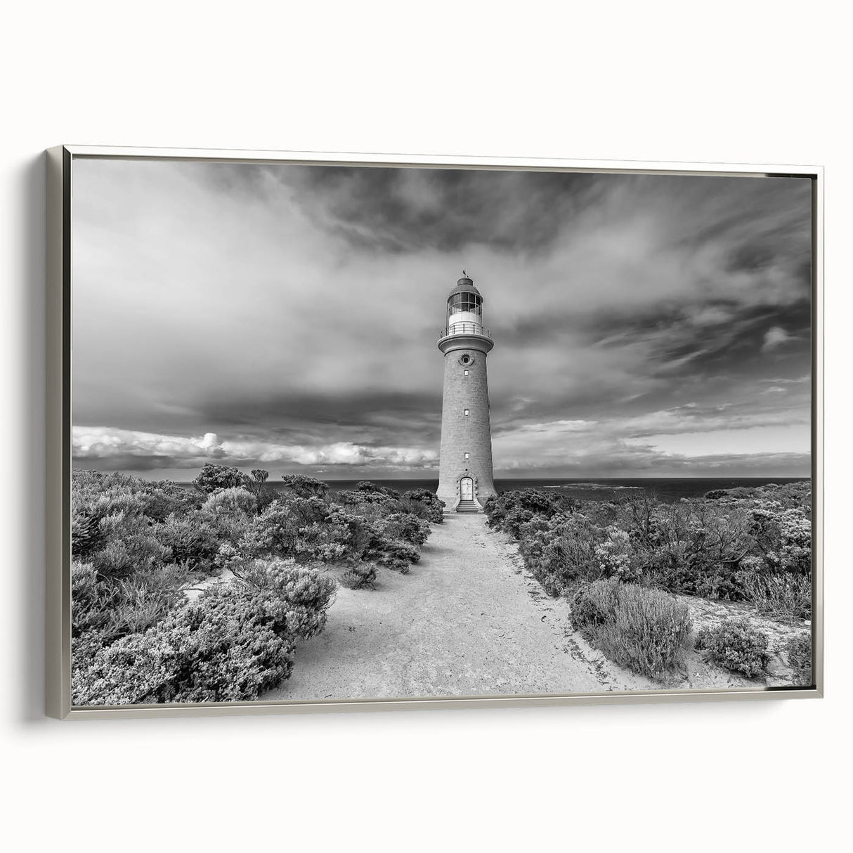Framed canvas wall art showcasing a stunning landscape of rugged cliffs with a silver frame, ideal for modern home decor and interior design enthusiasts.