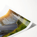 Vibrant rolled wall art print depicting dramatic cliffs and serene landscapes, showcasing rich colors and intricate details, perfect for home decor enhancement.