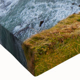 Close-up of a stretched canvas wall art piece depicting a stunning landscape with cliffs, showcasing vibrant colors and intricate textures, perfect for home decor.