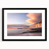 Framed wall art showcasing a stunning landscape of cliffs in vibrant colors, featuring a sleek black frame and white matting, perfect for modern decor.