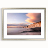 Framed wall art showcasing a serene landscape of cliffs, featuring a silver mat and elegant design, perfect for home decor enhancement and artistic expression.