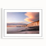 Framed wall art showcasing a stunning landscape of cliffs, featuring vibrant colors and rich textures, set in a sleek white frame with a mat, perfect for home decor.