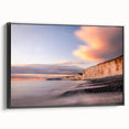 Framed canvas wall art showcasing a stunning landscape of cliffs in muted earth tones, presented from a side view with a sleek black frame, ideal for modern decor.