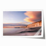Colorful landscape wall art print showcasing dramatic cliffs and vibrant skies, rolled and ready for framing. Perfect addition to modern home decor.