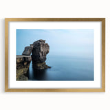 Framed wall art featuring a stunning landscape of cliffs in warm tones, elegantly bordered with a gold mat, perfect for home decor or office inspiration.